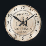 Relógio Redondo Newlyweds Rustic Personalizados<br><div class="desc">Um relógio rústico de madeira moderna monograma de muro de casamento com data estabelecida e nome casado.</div>