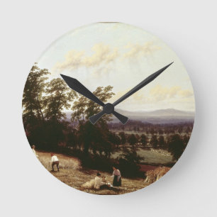 Relógio Redondo Os monte de feno aproximam um rio, perto de