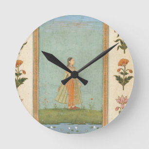 Relógio Redondo Senhora segurando uma flor, parada por uma lagoa d