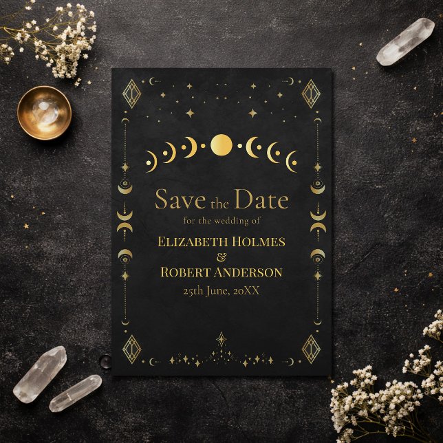 Reserve A Data Celestial Gothic Black and Gold Save the Date Card (Celestial Gothic Black and Gold Save the Date Card on an elegant dark table with dry flowers)