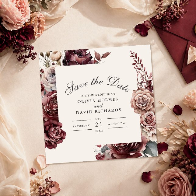 Reserve A Data Elegante Burgundy & Rosa Desbotada Floral Save the (Elegant Burgundy & Dusty Rose Floral Save the Date on a table with wedding decoration)
