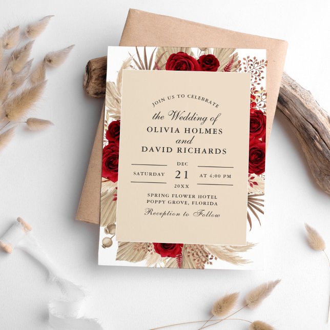 Rosas de Borgonha e Convite para Casamento de Gras (Burgundy Roses and Pampas Grass Wedding Invitation on a white table sorrounded with dry palm leaves.)