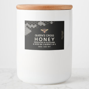 Rótulo de mel com favos de mel e abelha preta