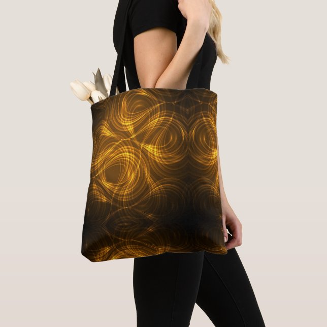 Saco tote com padrões de luz dourada giratória (Close Up)