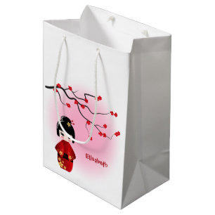 Sacola Para Presentes Média A boneca japonesa do kokeshi em sakura floresce