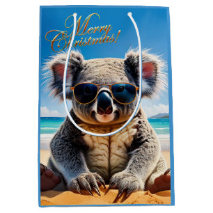 Sacola Para Presentes Média Koala em uma praia arenosa Feliz Natal