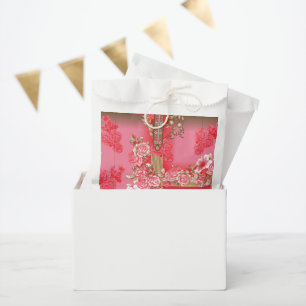 Sacolinha design de fundo rosa e ouro com vermelho