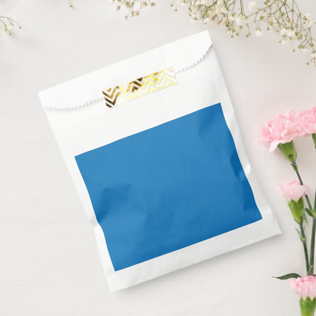 Sacolinha um fundo azul com um relógio preto e branco (Selado)