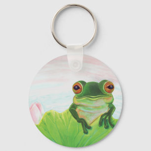 Sapo verde atrás do chaveiro da almofada de lírio