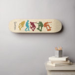 Skate Para Colagem de Gráficos Skateboarders<br><div class="desc">Surpreenda seu skater favorito com um baralho de skates personalizado. Apresenta ilustrações do estilo silhueta de skate em amarelo-mostarda,  azul-turquesa,  vermelho-escuro,  verde e laranja-ferrugem contra fundo de madeira falsa e está pronto para ser personalizado com um nome em letras coloridas de cinza carvões.</div>