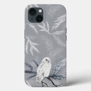 Snowy Owl no pinheiro de inverno