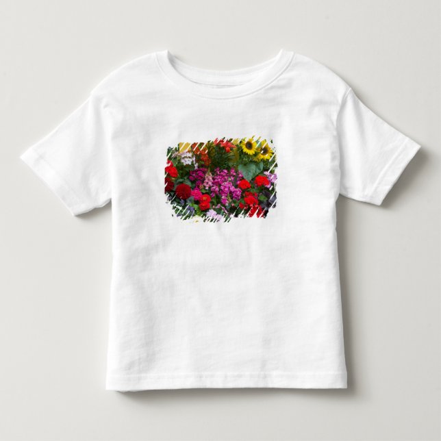 T-shirt Cerca de estacas amarelas com jardim de flores em (Frente)
