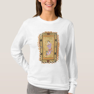 T-shirt Menina assentada que ondula seu cabelo em