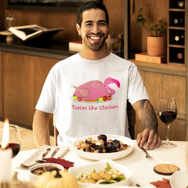 T-shirt Tem Gosto de Frango Funny Flamingo (male model at a holiday dinner wearing pink flamingo tastes like chicken funny t-shirt)