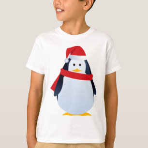 T-shirts Pinguim do Natal em um chapéu do papai noel