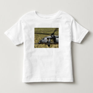 T-shirts Um HH-60 pavimenta o falcão voa sobre o deserto