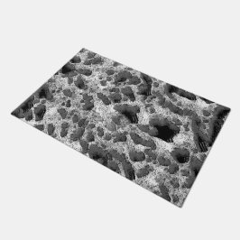 Tapete Coral com travesseiro redondo preto e branco a cor