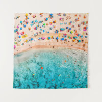 Aerial view of sandy beach with colorful umbrellas