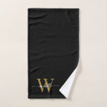 Toalha De Mão Nome Monograma Preto Dourado Elegante Stylish Scri<br><div class="desc">Toalha de mão personalizada com monograma inicial preto e dourado, feminino e moderno, com nome ou iniciais em letra manuscrita. Apresenta um primeiro nome (ou sobrenome da família) em uma linda tipografia de letra manuscrita com cauda ornamentada (ou caligrafia) com monograma inicial em dourado e branco sobre preto. Ótimo presente...</div>