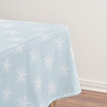 Flocos de neve brancos no tablecloth. azul do Xmas