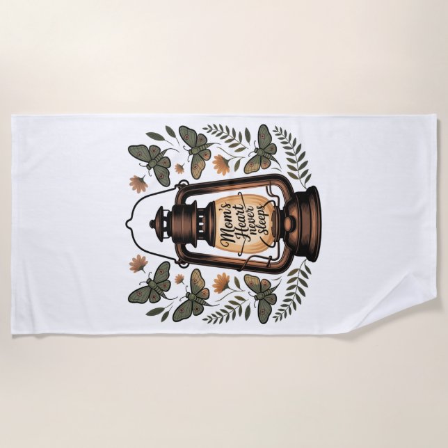 Toalha De Praia Mom’s Heart Never Sleeps (Frente)