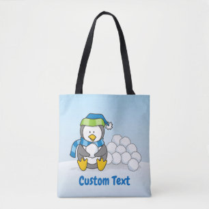 Tote Pequeno pinguim sentado com bolas de neve na bolsa