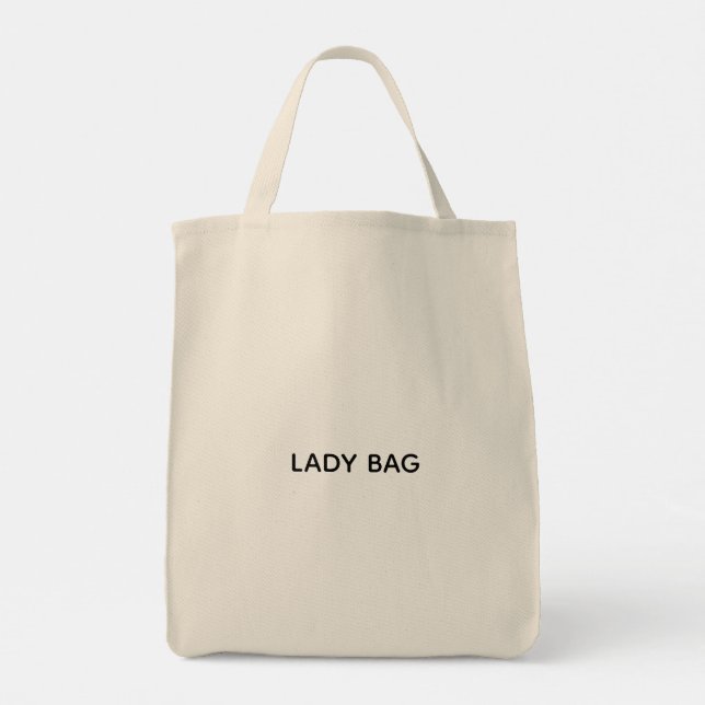 Tote Uma bolsa bege com o texto "LADY BAG" impresso  (Verso)