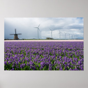 Traditional and modern windmill in Holland poster