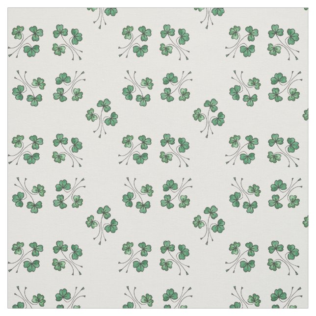 Trevos verdes bonito no tecido branco do teste (Modelo)