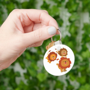 Trio feliz do chaveiro bonito dos leões dos