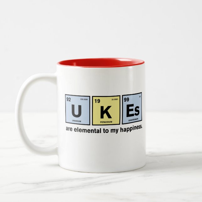 Ukulele e caneca engraçados da ciência (Esquerda)