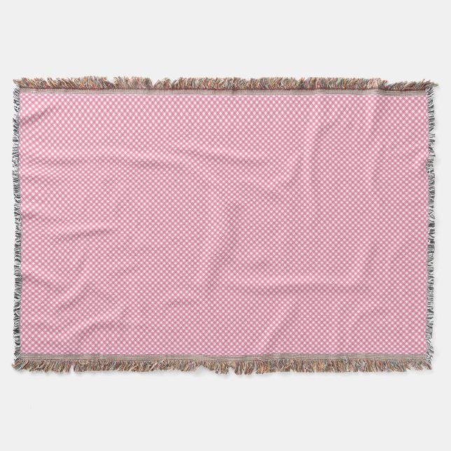 Um cobertor tecido rosa com um padrão sutil (Frente)
