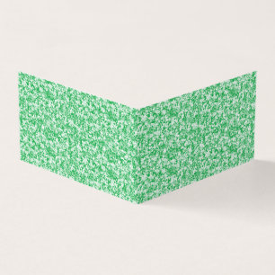 um fundo verde e branco com pequenos pontos branco