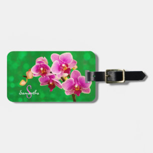 Uma etiqueta de bagagem de orquídea roxa