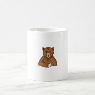 urso pardo com uma xícara de café
