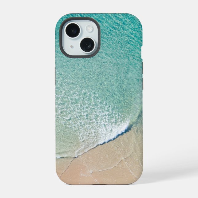 Vista aérea sobre uma praia e um oceano azul (Verso)