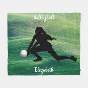 Voleibol feminino no cobertor de velo verde