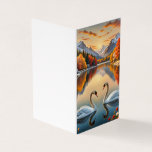 Whimsic Winter Love<br><div class="desc">A carta apresenta uma cena impressionante de dois golfinhos elegantes formando uma forma cardíaca com seus pescoços em um lago sereno e calmo. Eles deslizam graciosamente pela água, cercados por flores delicadas e flutuantes que gentilmente beijam a superfície. Ao fundo, montanhas majestosas se erguem contra um céu pintado em tons...</div>